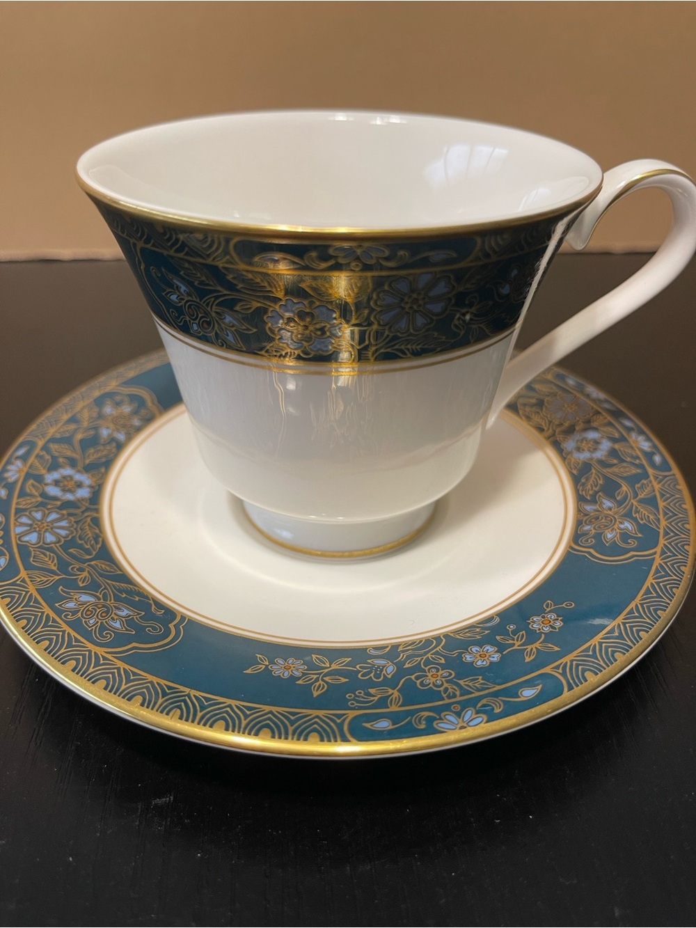 Royal Doulton White Teacup and Saucer with Blue and Gold Trim
